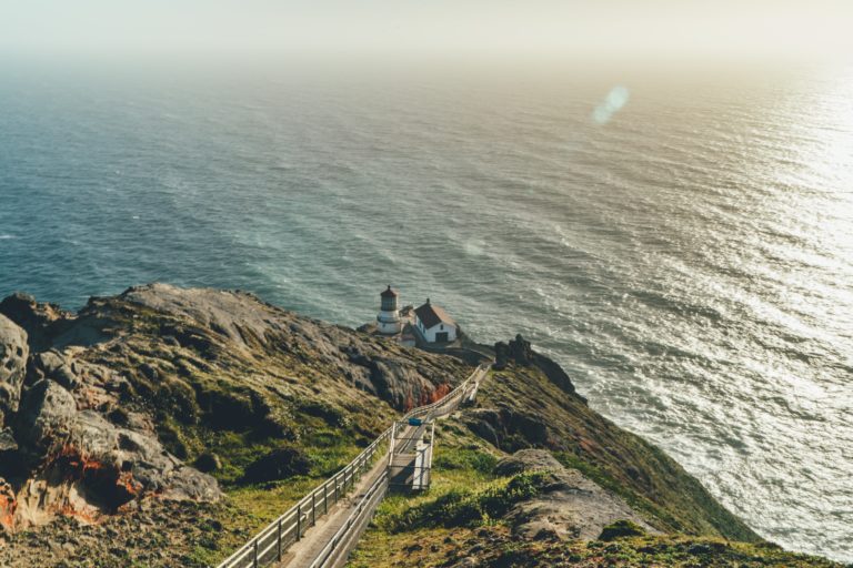 overhead view of point reyes light house and the pacific ocean at sunset