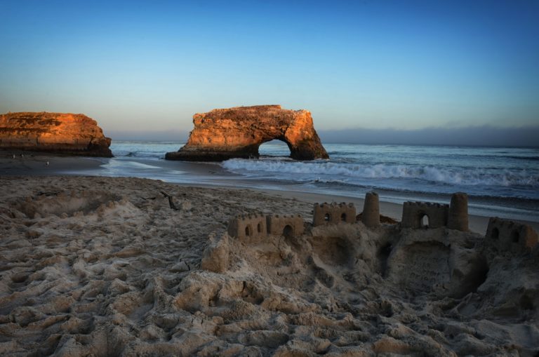 Sandcastles next to the Pacific Ocean at Natural Bridges State Beach in Santa Cruz, California