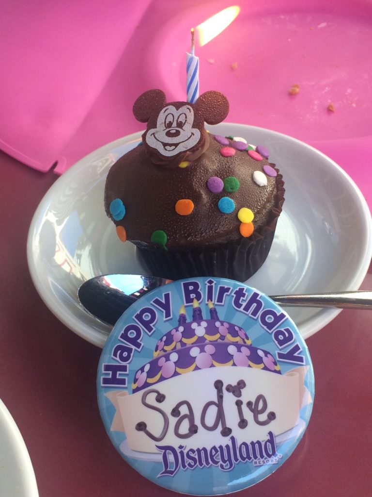 Disneyland button that read happy birthday, Sadie.