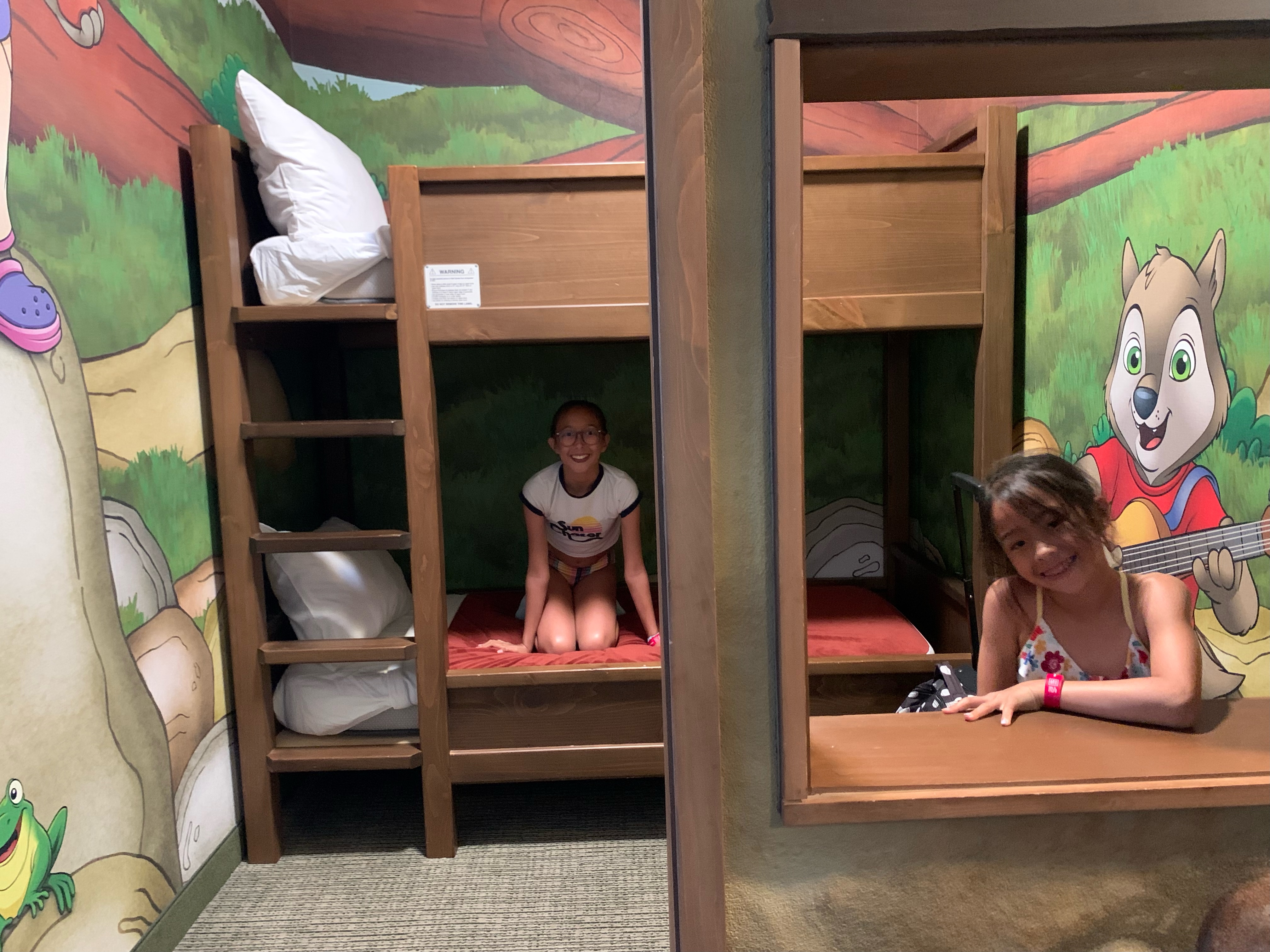 two girls in the wolf den suite at Great Wolf Lodge in Manteca, California