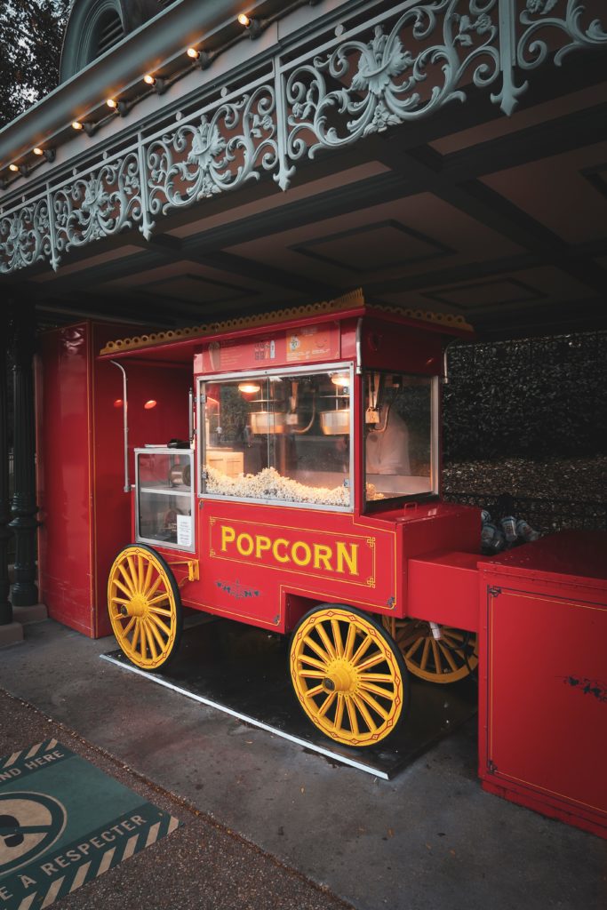 red and yellow popcorn cart at Disneyland