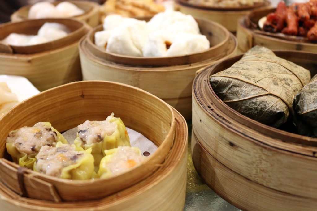 assortment of dim sum in steaming baskets