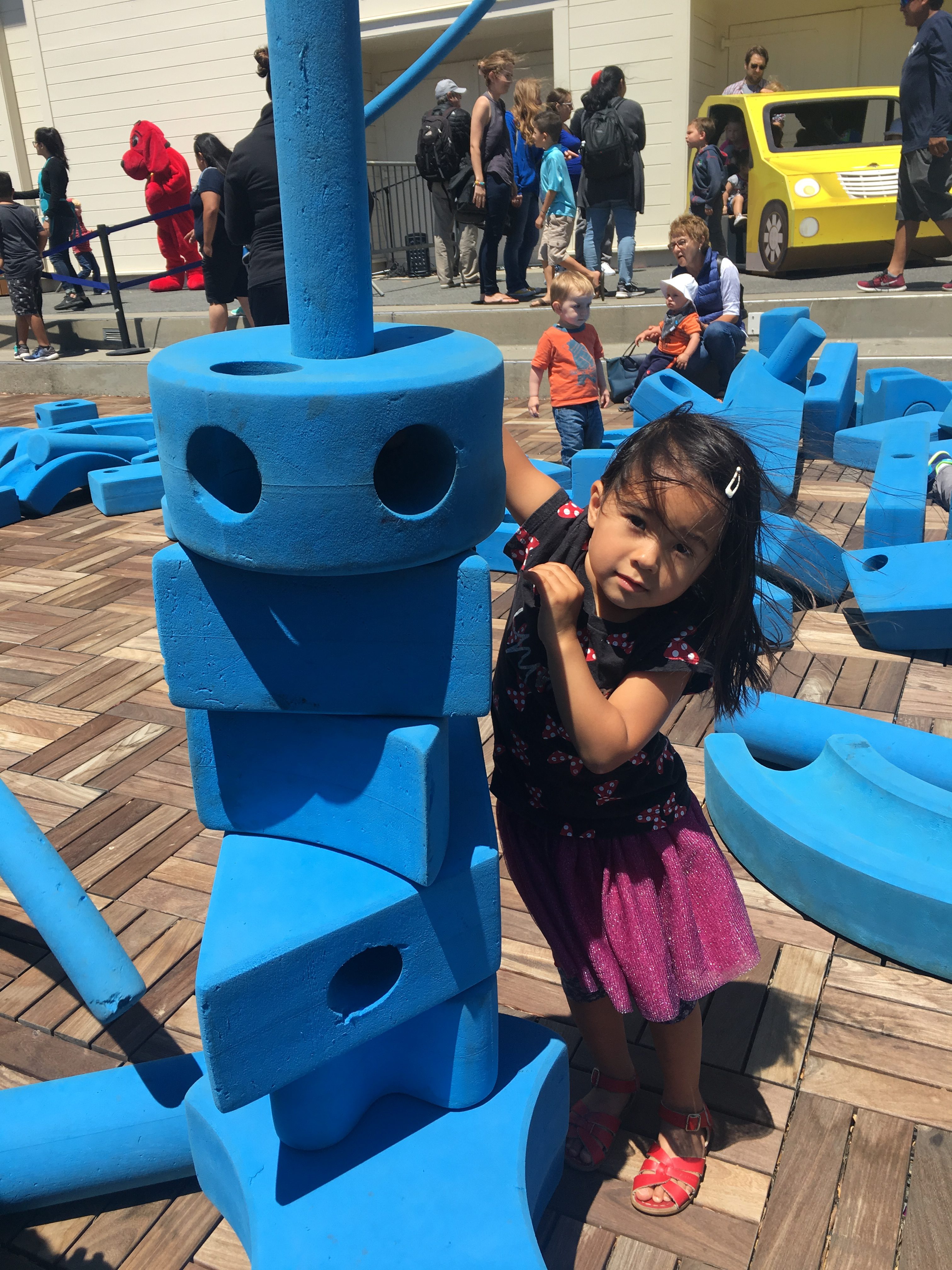 girl building with large blocks at the Bay Area Discovery Museum