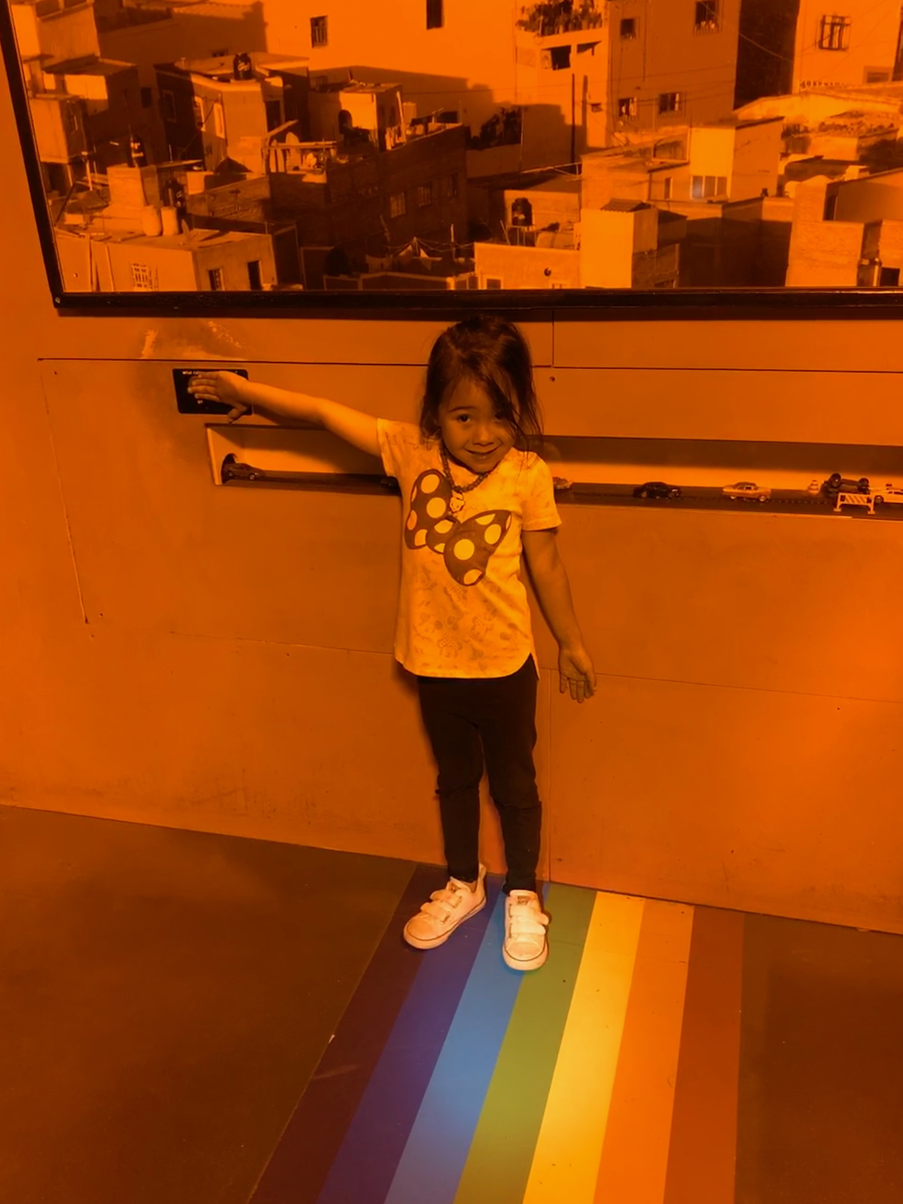 girl in a monochromatic room in the Exploratorium