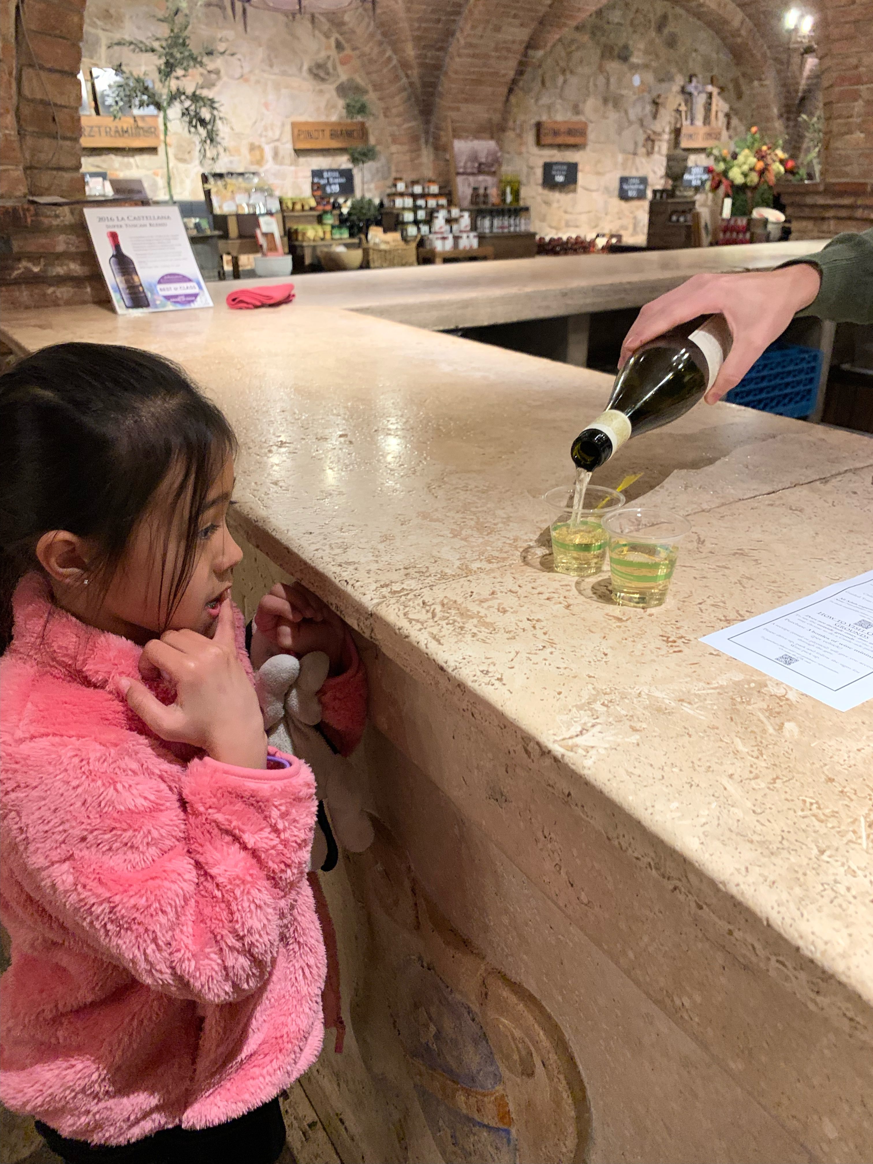 girl waiting for grape juice at Castello di Amorosa