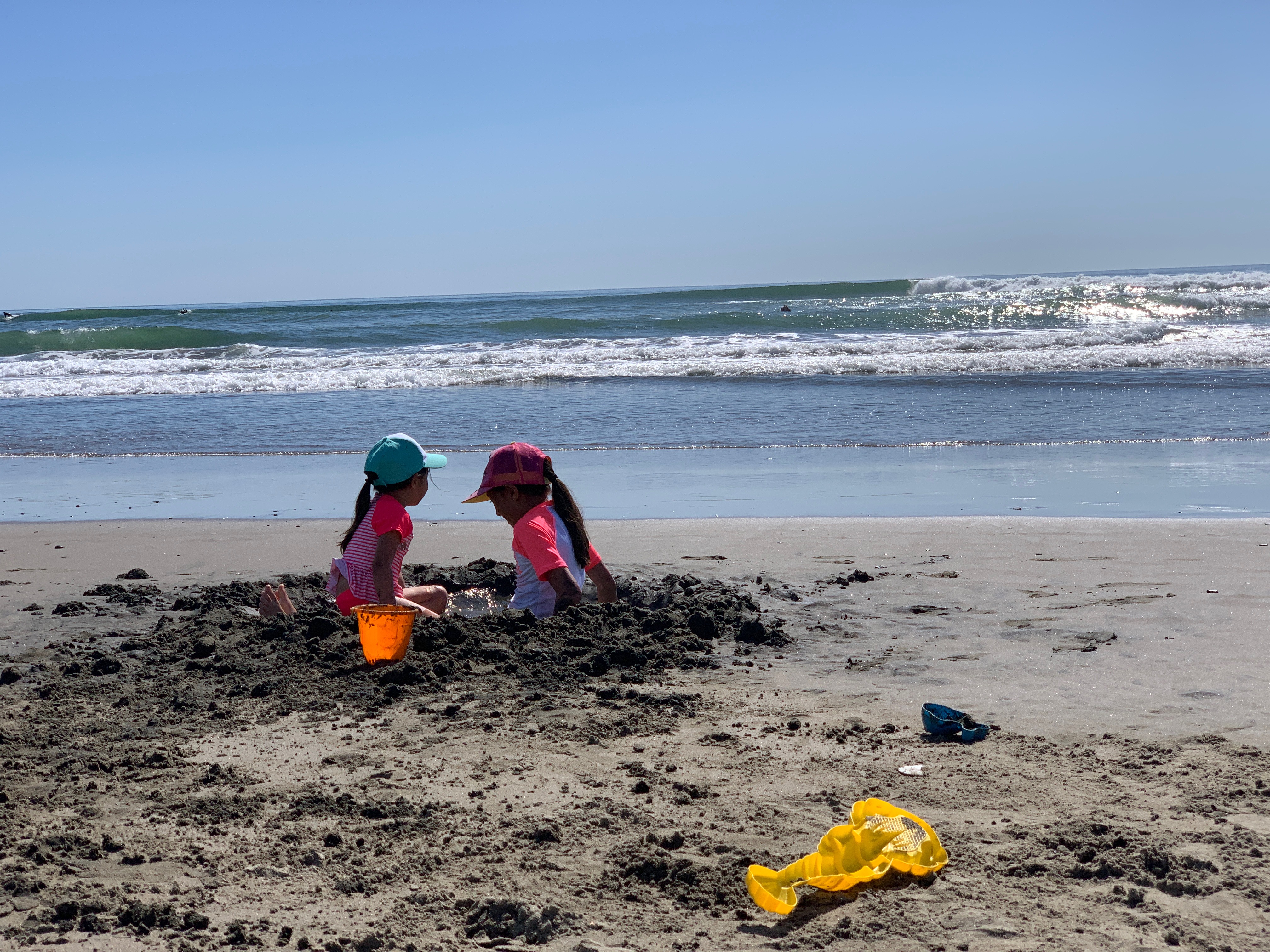 two kids playing in the sand at Ocean beach in San Francisco