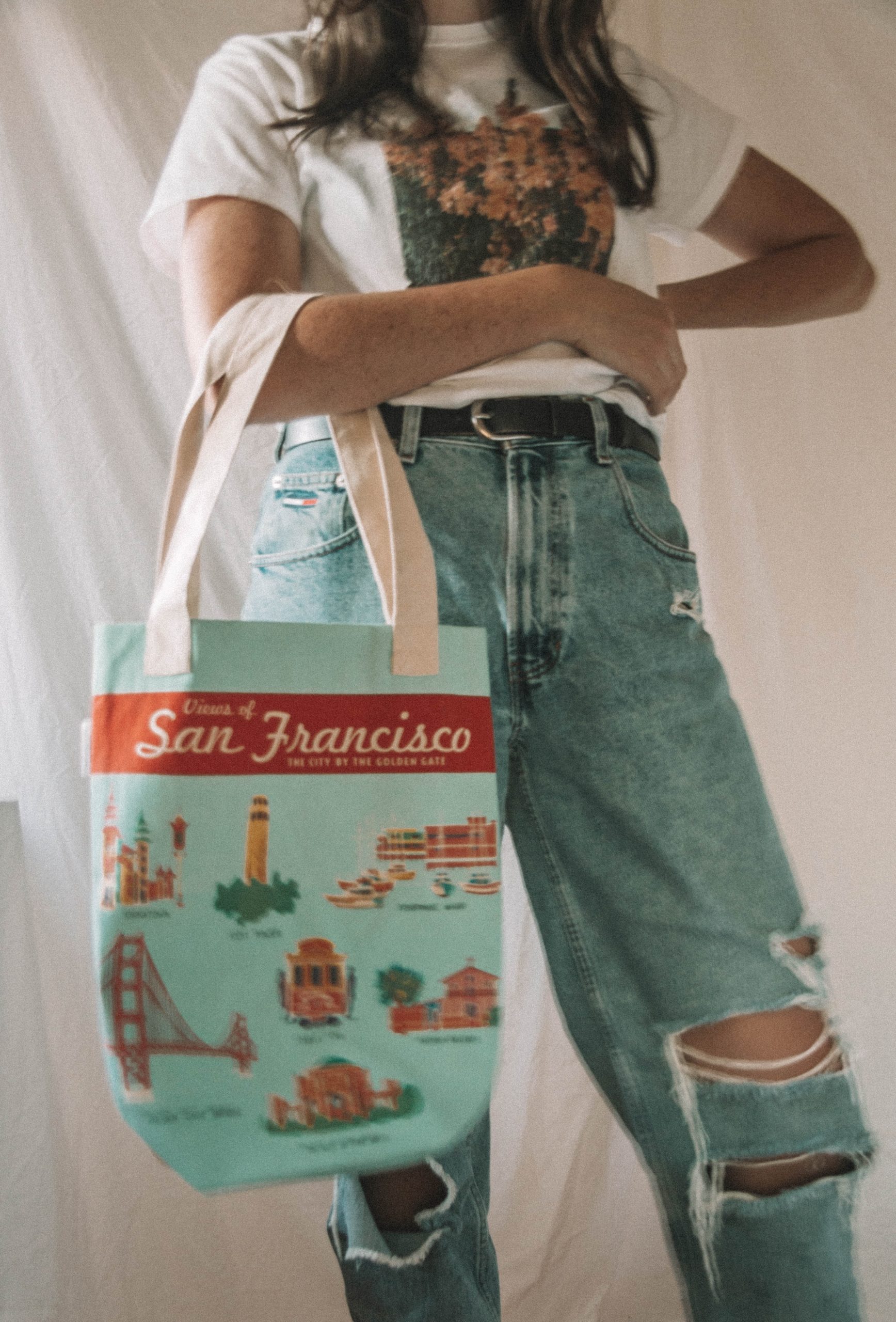 woman holding san francisco tote