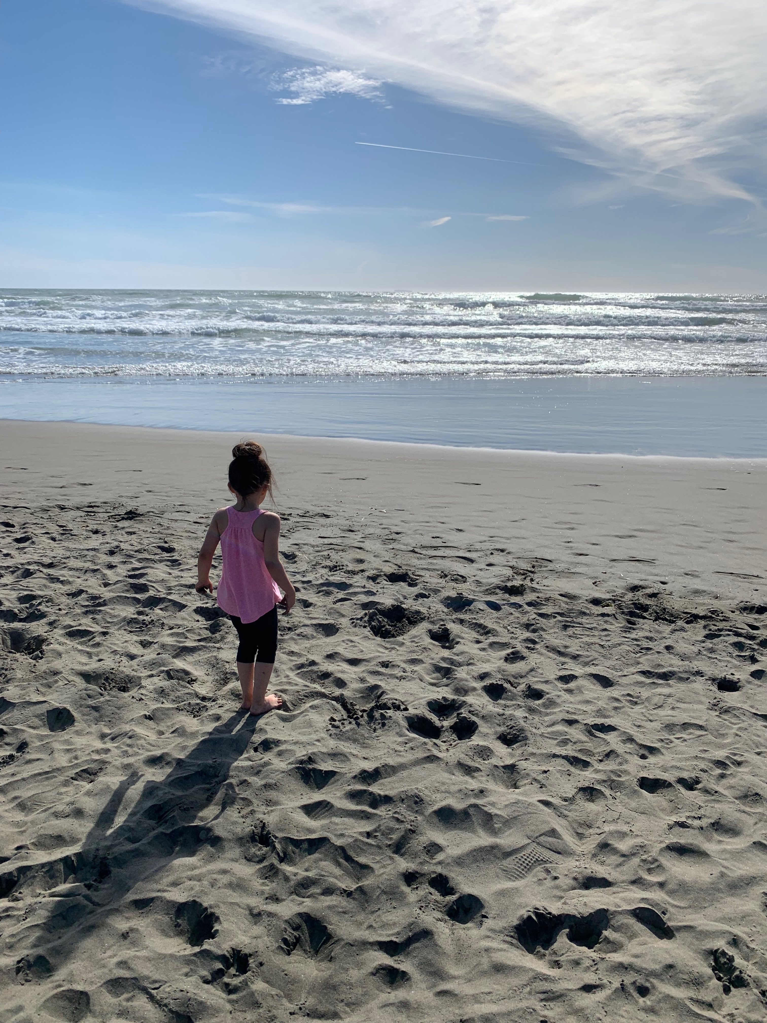 girl looking at the Pacific Ocean