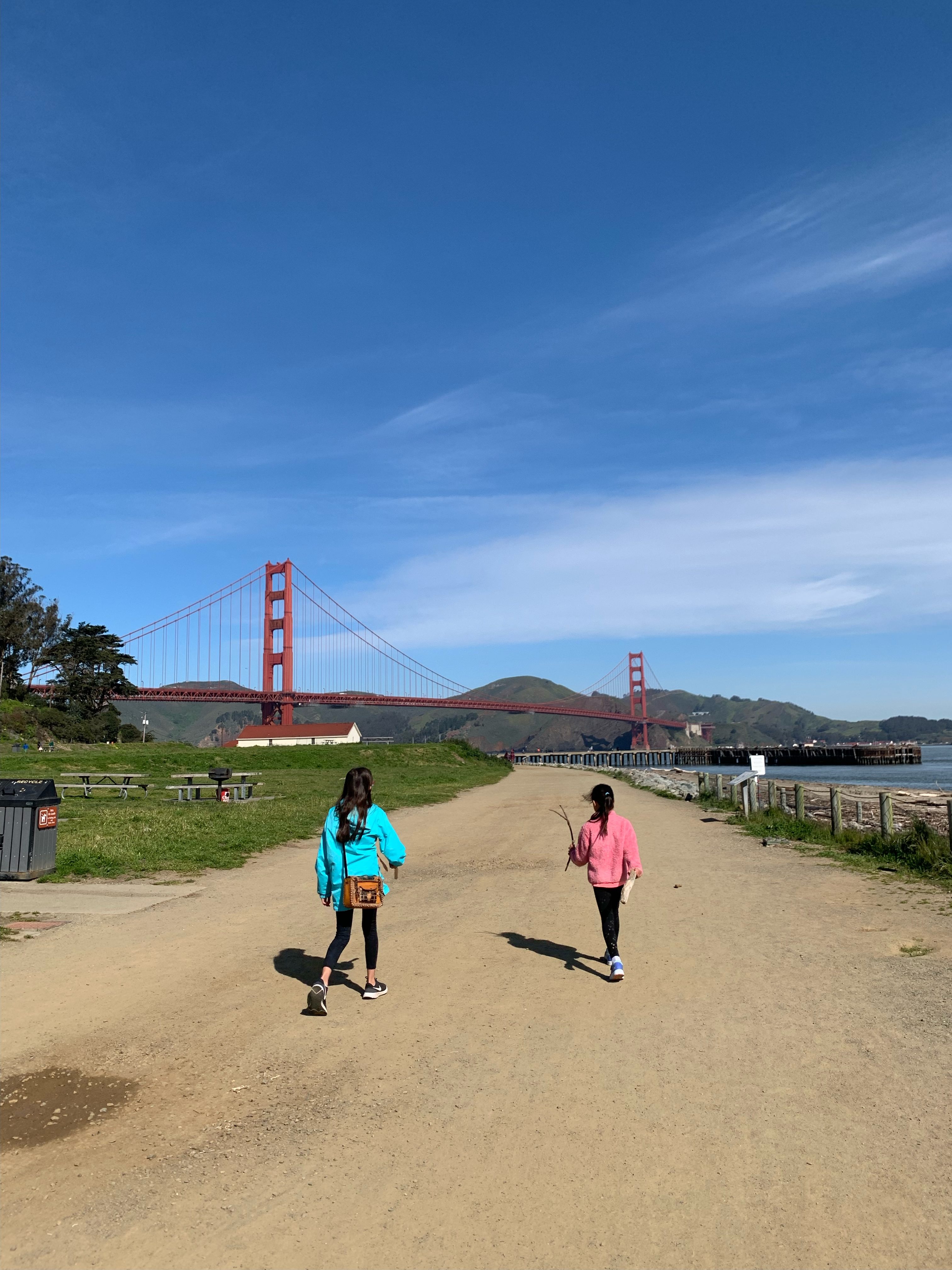 two girls walking along the West Bluff Picnic Area in San Francsico