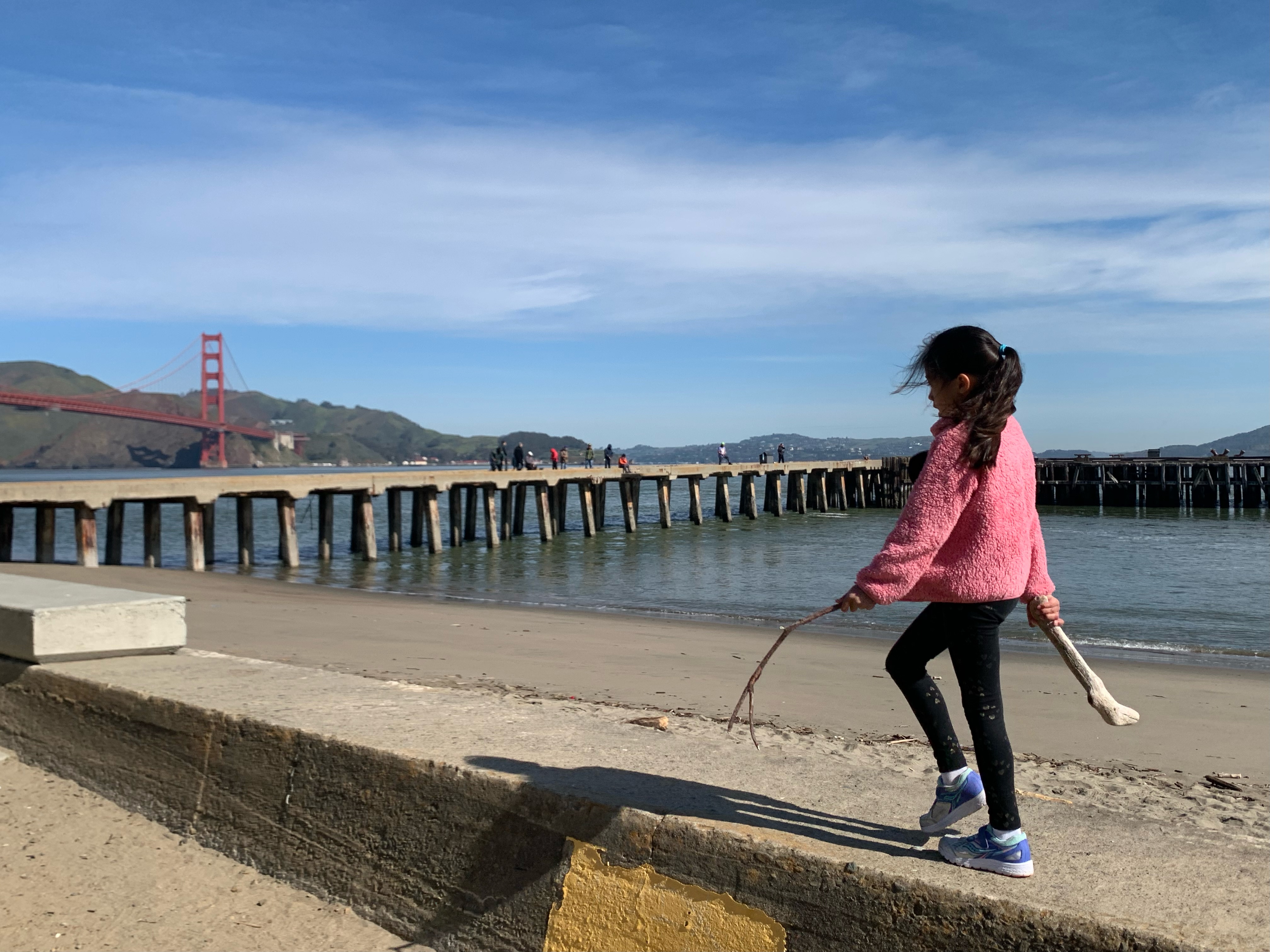 girl walking along the western bluff picnic area in san francsico