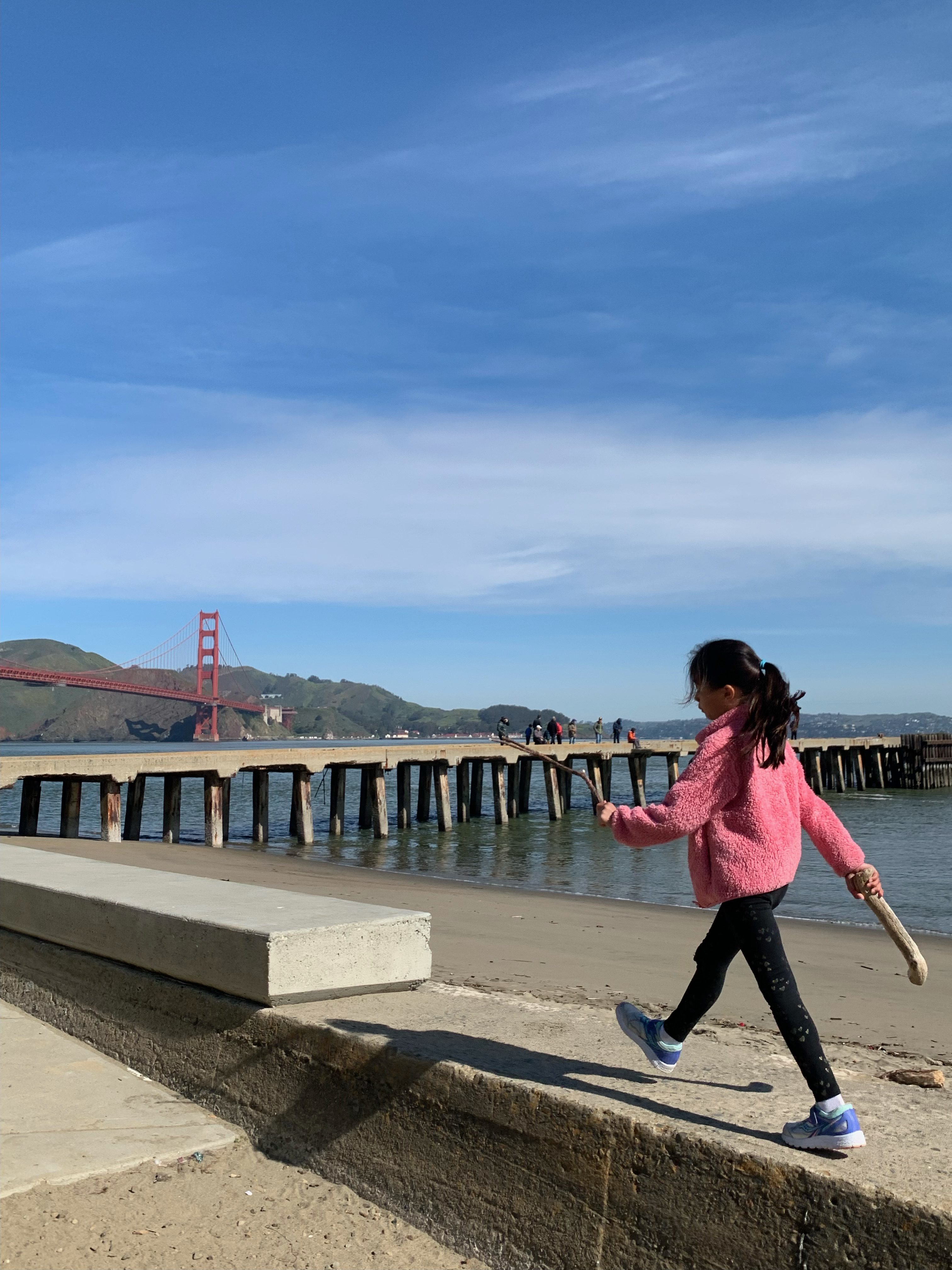 girl walking around san francisco west bluff