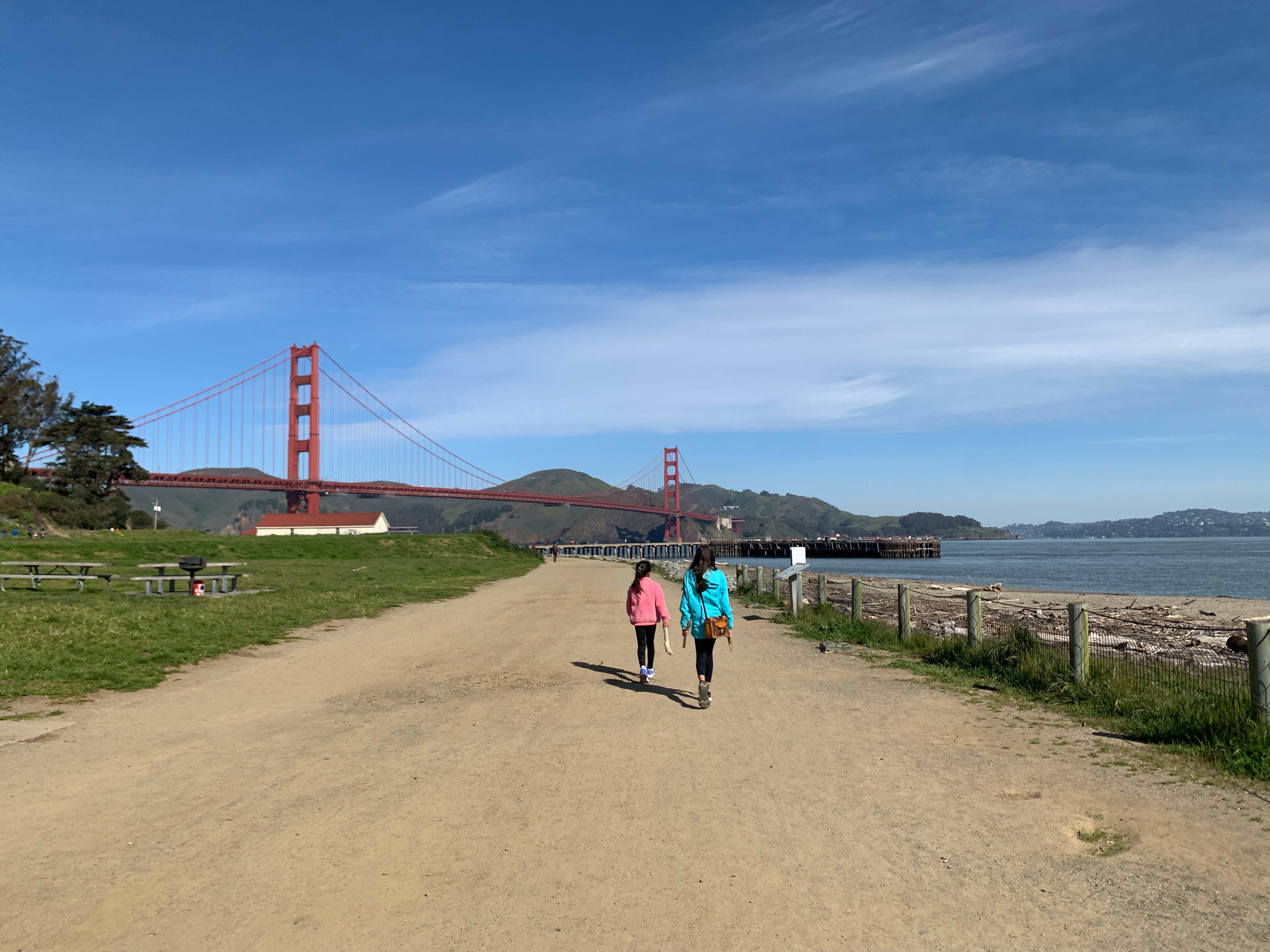 kids walking at crissy field west bluffs with view of golden gate bridge