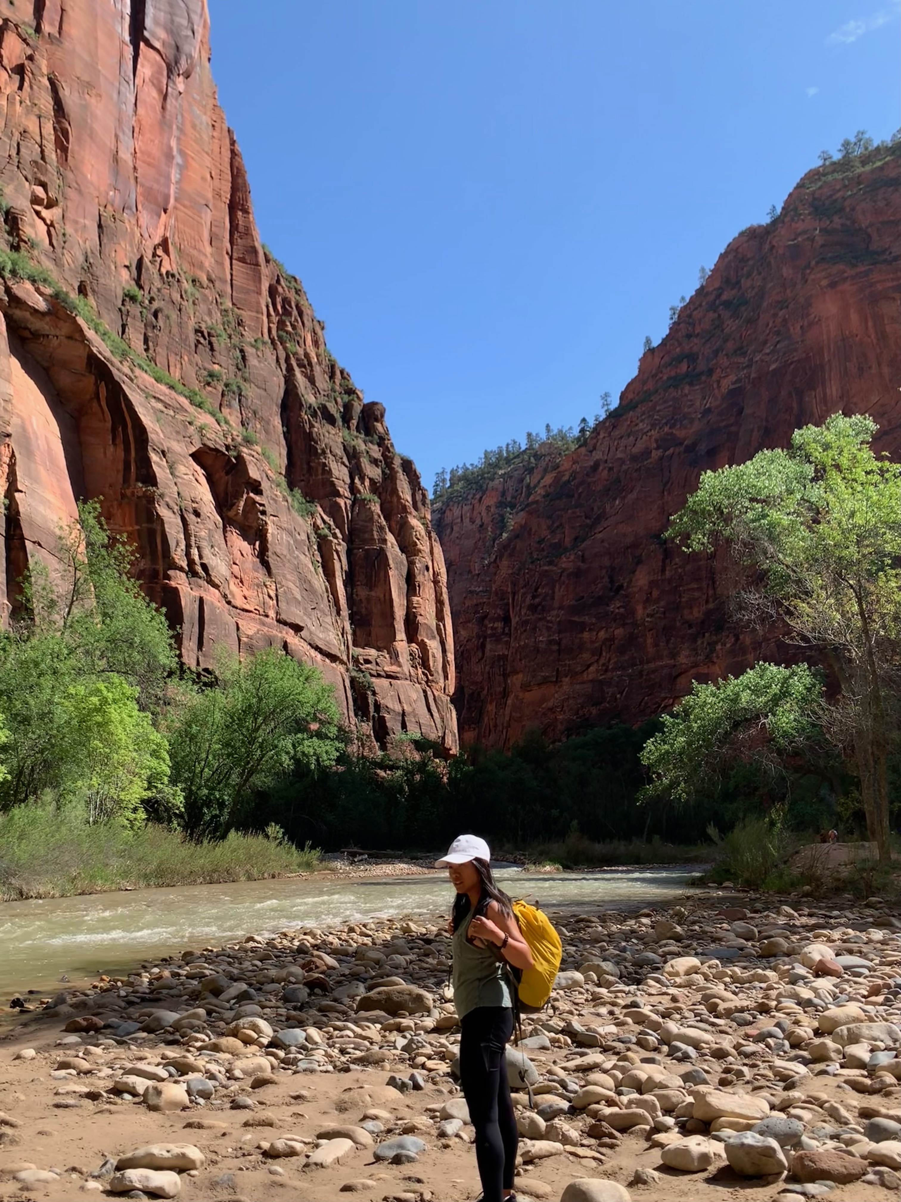 woman hiking through zion national park