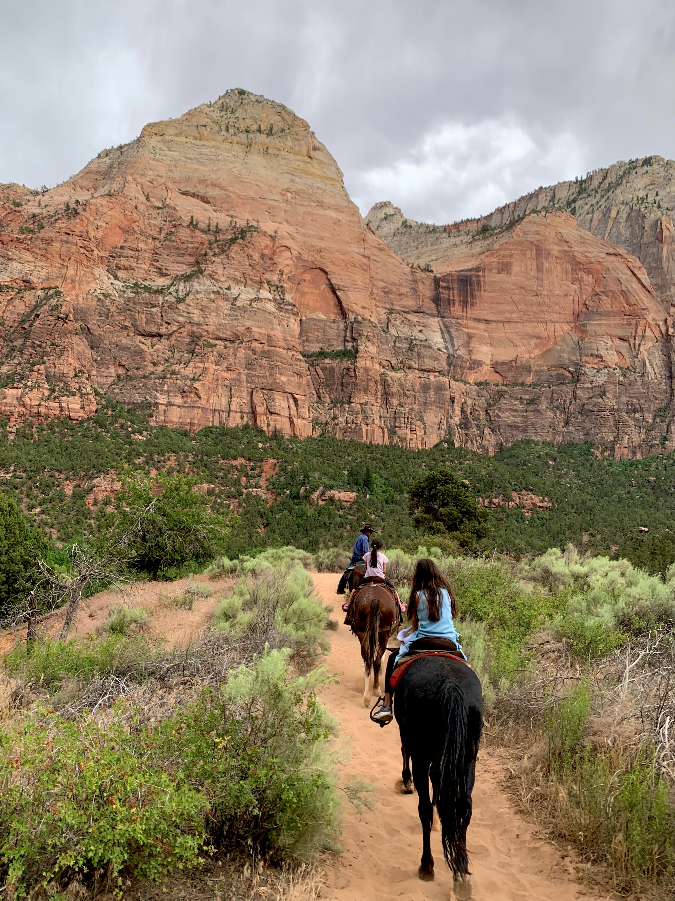 People riding horses in Zion national park