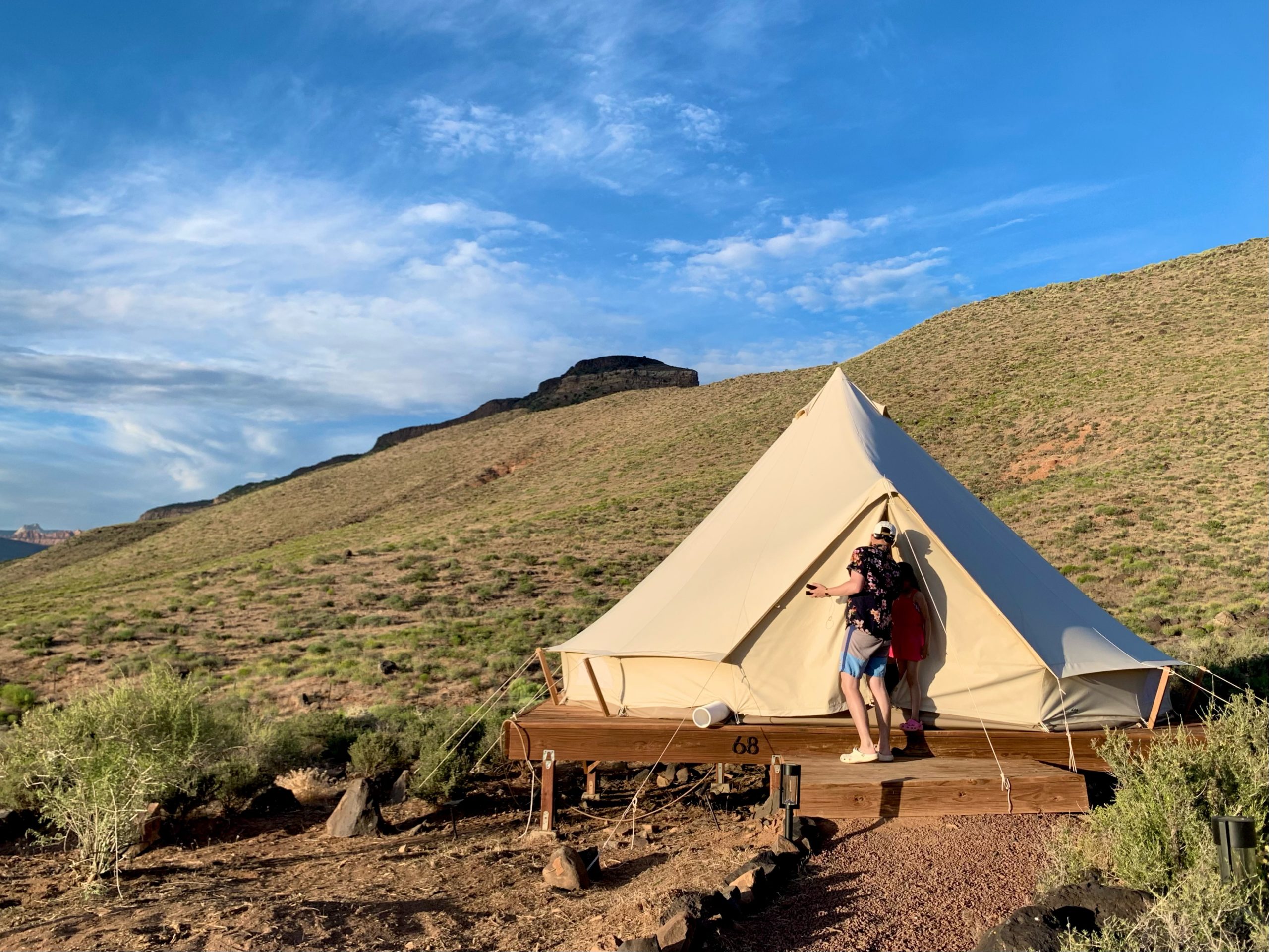 man going into a glamping tent by Zion National Park