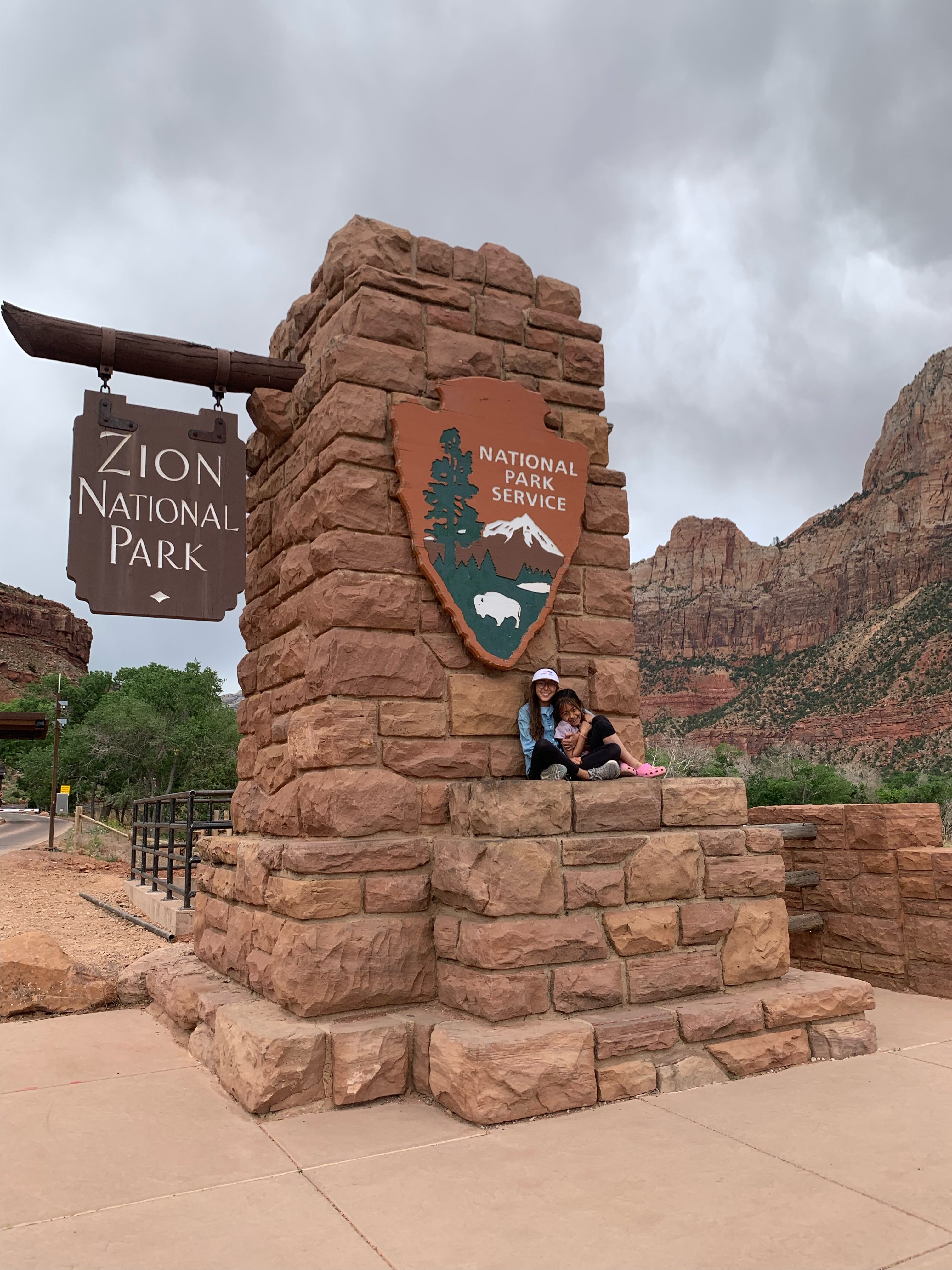 two girls at the entrance of zion national park